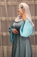 Woman wearing multiple colors available luxury arabian dubai abaya — embroidered silk modest abaya by Rubab's Hijab