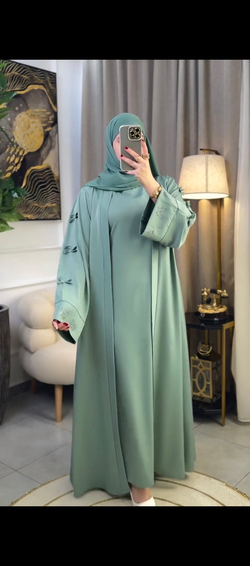 Woman wearing multiple colors available butterfly stone embellished abaya — embellished nida modest abaya by Rubab's Hijab